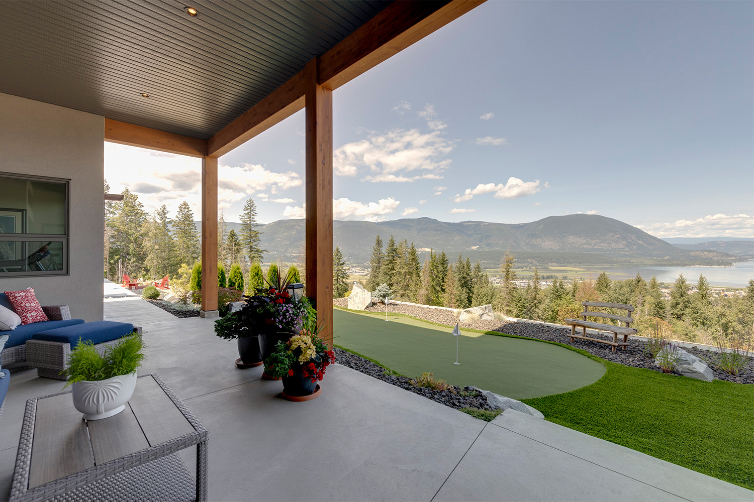 patio and backyard with small putting green, beautiful view overlooking shuswap lake