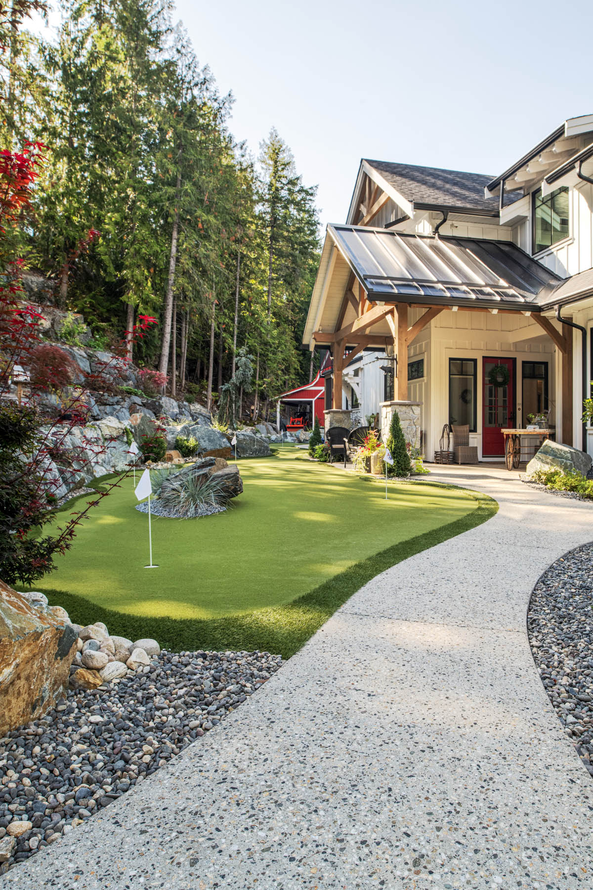 A graceful home with a personal putting green nestled in a tranquil woodland setting.